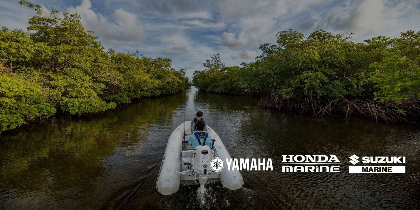 Inflatable boat with an outboard motor carrying two people through a mangrove-lined channel, with Yamaha, Honda Marine and Suzuki Marine logos overlaid.