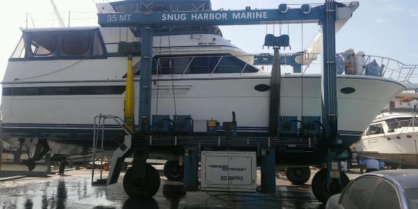 Motor yacht raised on a 35-ton travel lift at Snug Harbor Marine.