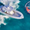 Aerial view of a white motorboat under way on blue water