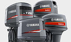 Three Yamaha outboard motors displayed side by side, with Yamaha and Verado badging visible on the cowlings.