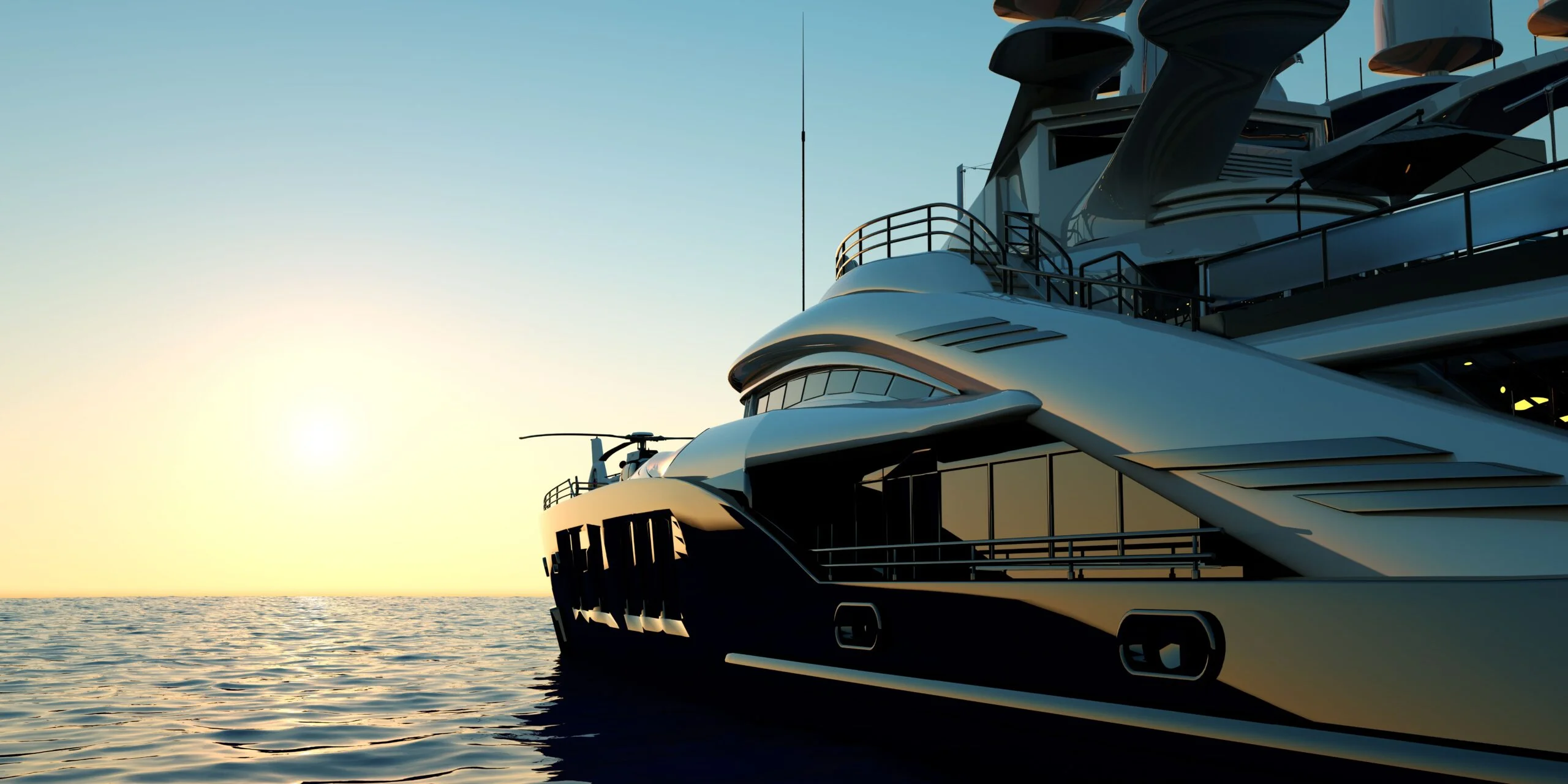 Luxury superyacht with a helicopter on its foredeck, sailing on calm water at sunset.