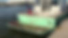 Green-painted boat hull photographed at the water's edge, with no business name or town visible.