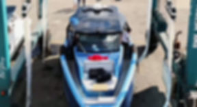 Blue and black personal watercraft secured on a trailer or rack, photographed from above, with no business name or town shown.