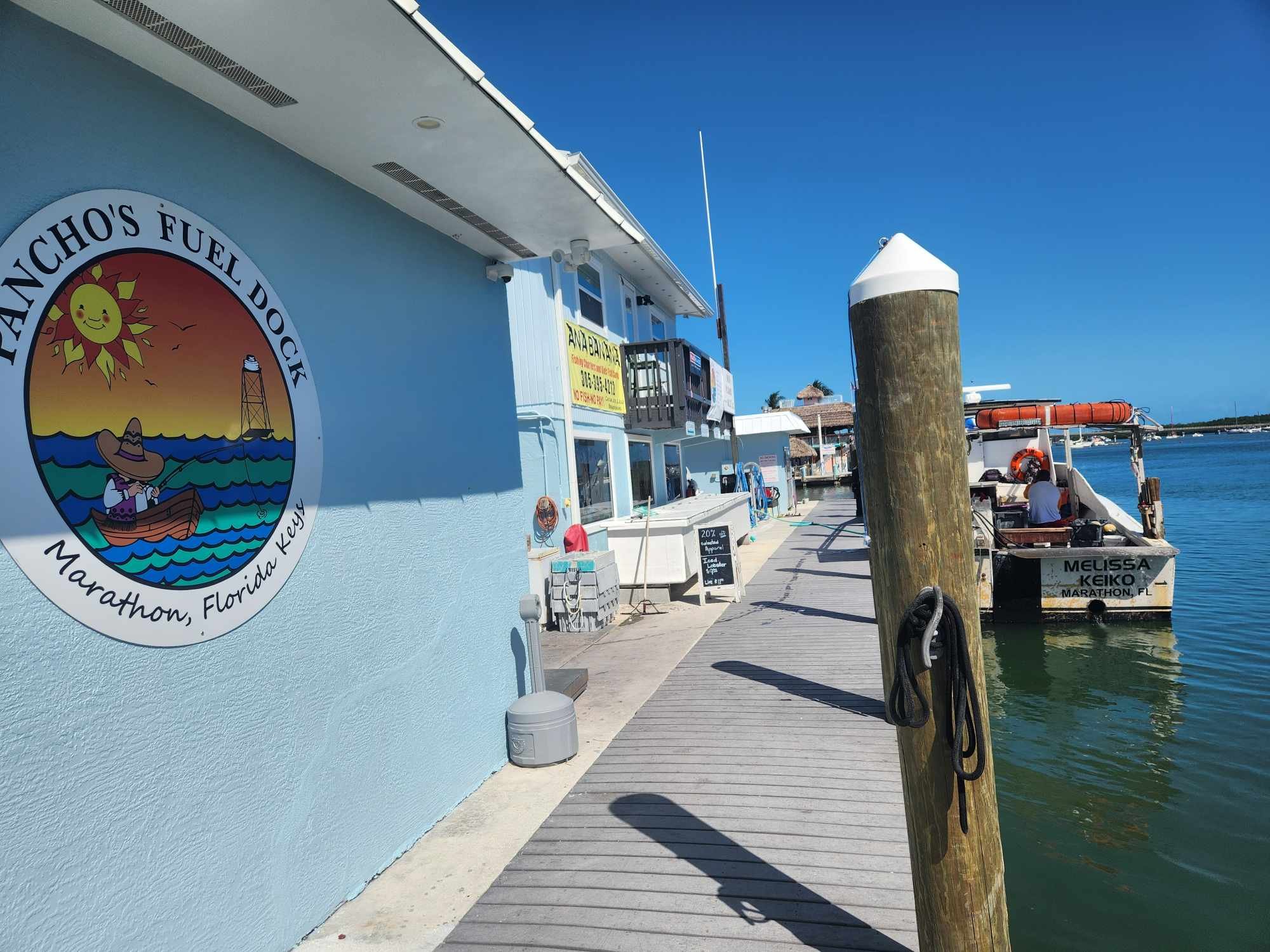 Dock boardwalk and moored boat at Pancho's Fuel Dock, Marathon.