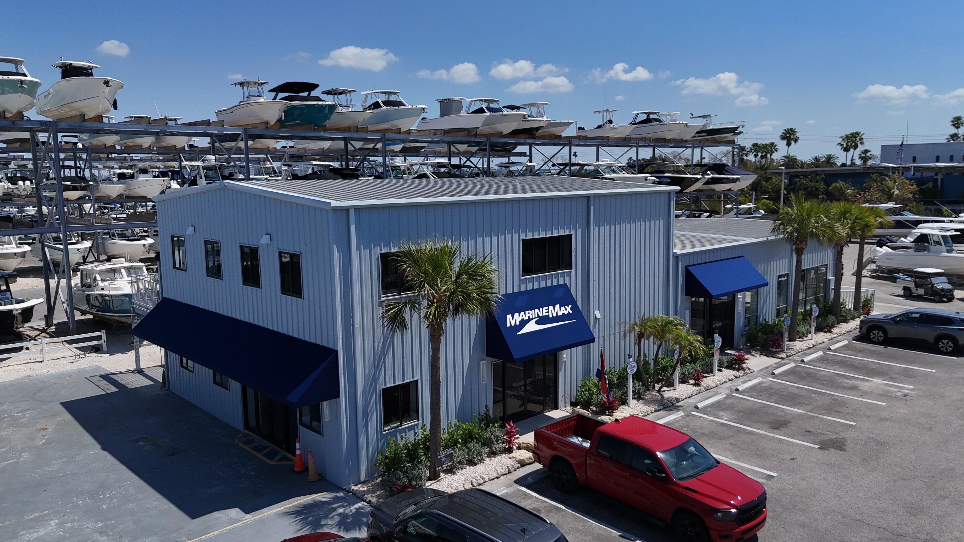 Aerial view of the MarineMax dealership building with boats stored on dry-stack racks at MarineMax, Florida.